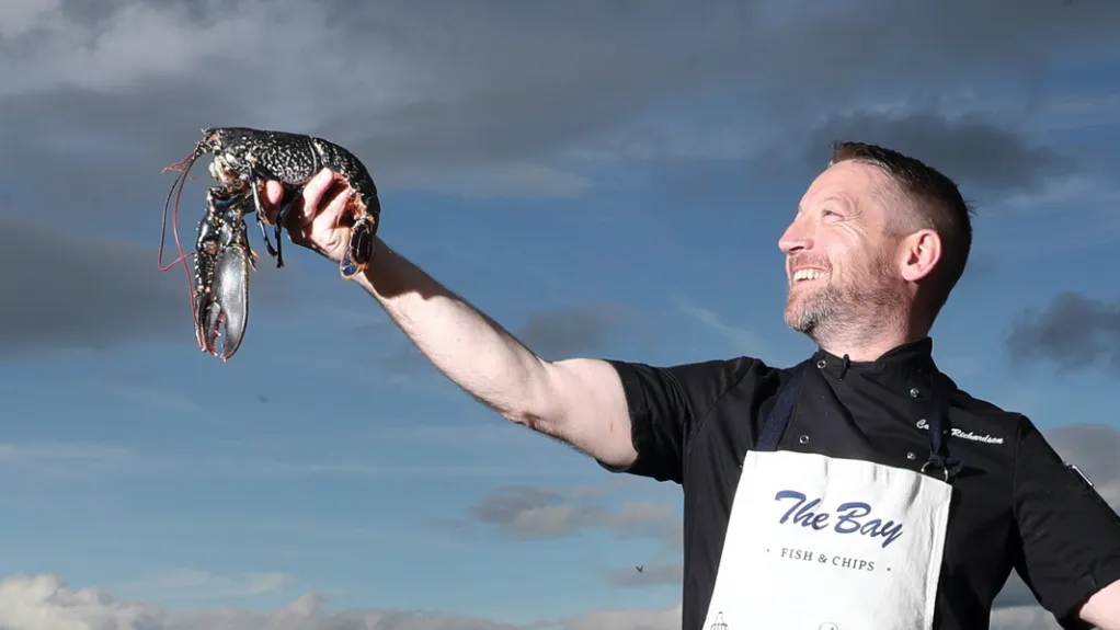 The Bay - Founder Calum, with a fresh lobster in hand