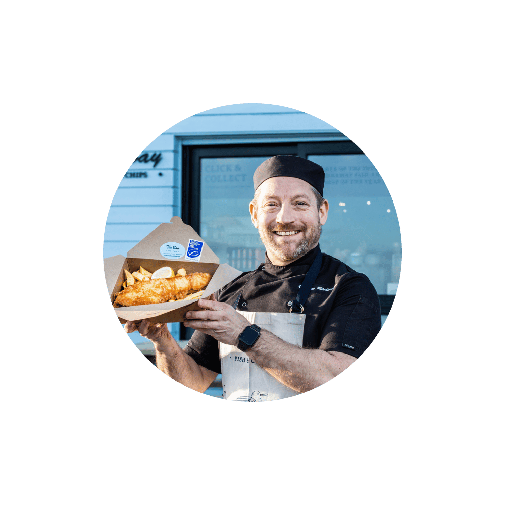 Calum Richardson with fish and chips box